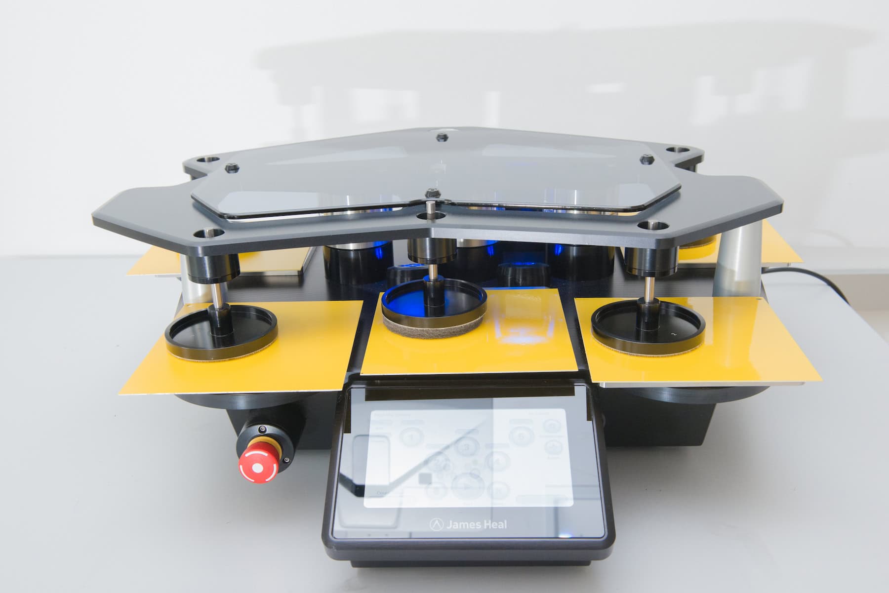 Martindale testing machine with coated test panels